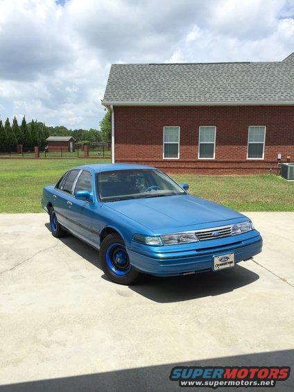 Blue 1994 Ford Crown Victoria with a license plate frame that says Ford Crown Victoria