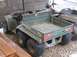 1981 Ford Bronco - A John Deere Trail Gator utility vehicle is shown from the rear, parked indoors with other recreational vehicles.