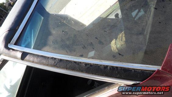 Red 1972 Ford Ranchero interior showing cracked windshield and black trim