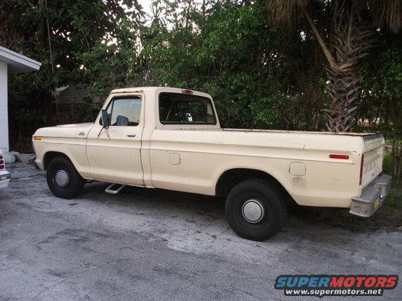 Side view of a 1979 Ford F-150 pickup truck in cream