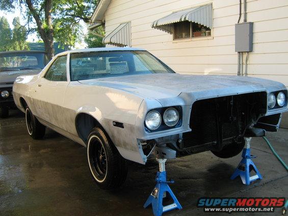 1973 Ford Ranchero on jack stands, front end disassembled