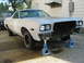 1973 Ford Ranchero - This vehicle is undergoing repairs, with its front end removed and supported by jack stands.