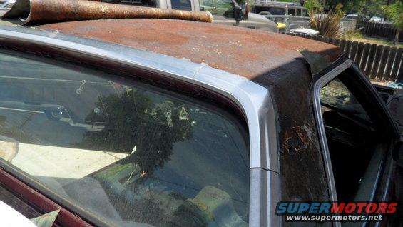 1972 Ford Ranchero side view showing rusty roofline and interior