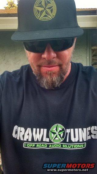 Man in "Crawl Tunes" t-shirt and star logo hat