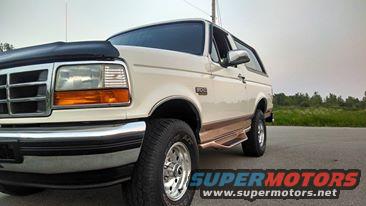 White 1994 Ford Bronco parked on the side of a road