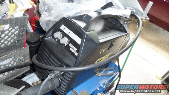 Black welding machine with 'SUPER MIG 180' label