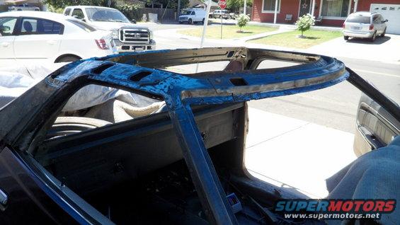rusted blue car frame, interior view
