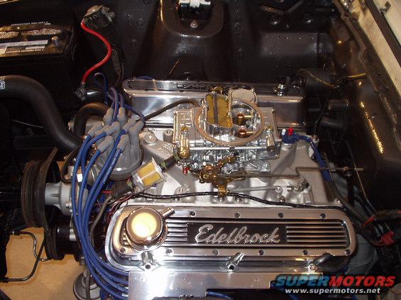 Engine bay with Edelbrock valve covers and carburetor