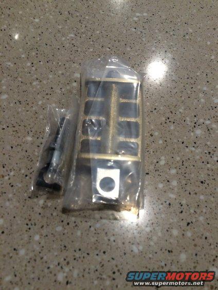 Motorcycle foot peg in plastic packaging with hardware