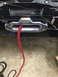 1994 Ford Bronco - WARN winch and red rope installed on a vehicle's front bumper.