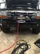 1994 Ford Bronco - This Ford F-Series truck has a custom bumper with a winch and auxiliary lights installed.