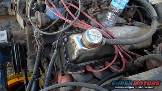 Ford V8 engine with chrome valve cover and red spark plug wires