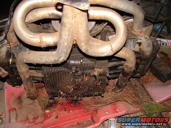 Close-up of a dirty, air-cooled Volkswagen engine with exhaust pipes