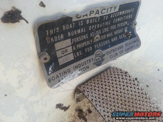 Boat capacity plate showing max weight and persons