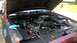 2004 Ford Crown Victoria - Engine bay of a 2004 Ford Crown Victoria, an aftermarket intake system and a Ford-branded fender cover.