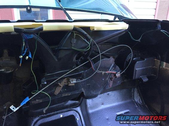 1979 Ford Bronco interior showing exposed wiring harness and HVAC components