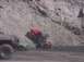 1988 Ford Bronco - An off-road buggy navigates a steep, muddy terrain, with other vehicles visible in the scene.