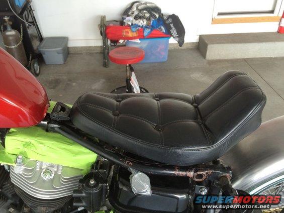 Black motorcycle seat and red gas tank