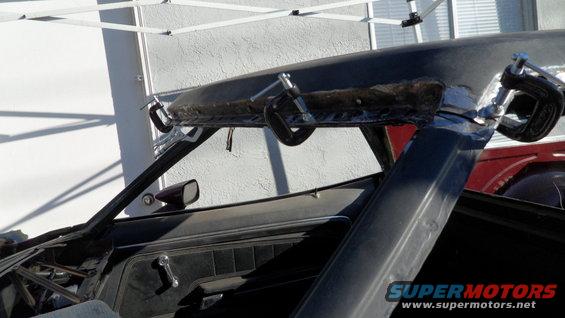 car roof being worked on with clamps
