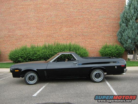 Black 1972 Ford Ranchero parked in a lot, side view