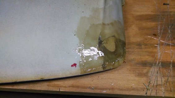Headliner with water damage and a small red mark