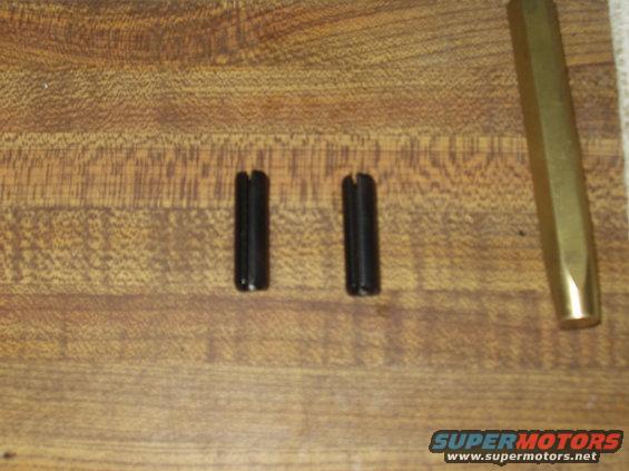 Roll pins to secure linkage arm to shift rail.