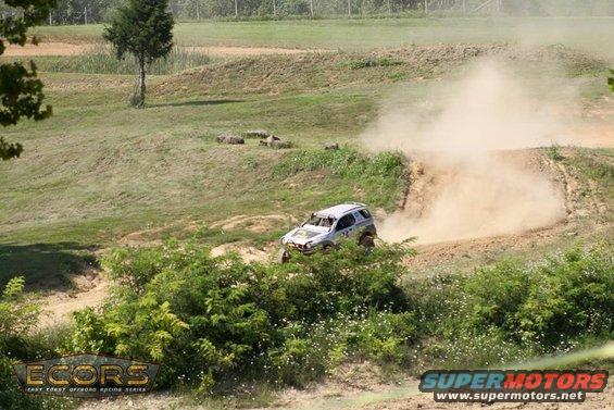 1999 Isuzu Vehicross driving off-road and kicking up dust