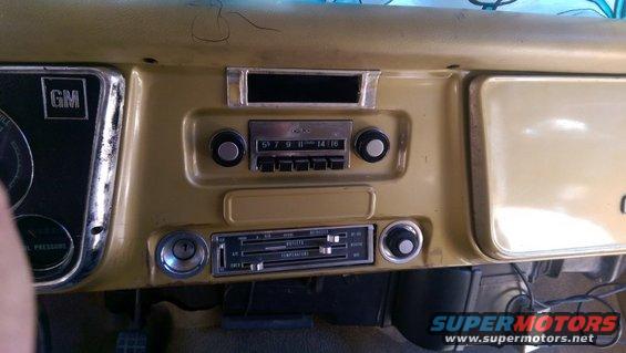 Interior dashboard of a 1967 Chevrolet C/K Pickup showing the radio and climate controls