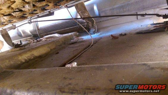 1968 Chevrolet C/K Pickup interior underside of seat, showing seat springs and floor pan with debris