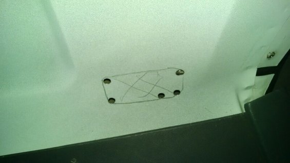 Interior panel with a drawn rectangle and holes drilled inside it