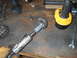 1992 Ford Bronco - Tools and parts for automotive differential repair are laid out on a wooden workbench.