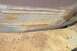1970 Ford F-250 - Close-up view of aged and corroded vehicle undercarriage parts, with visible rust and wear.