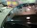 1990 Ford Taurus - A freshly painted car hood is shown, with spray cans and protective sheeting in the background.