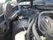 1995 Ford Bronco - A view of the engine bay, focusing on hoses and a small cylindrical component.