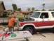 1978 Ford Bronco - Engine removal in progress on a 1978 Ford Bronco in a residential driveway.