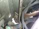 1995 Ford Bronco - Undercarriage view shows significant rust on the frame and various hoses and wiring.