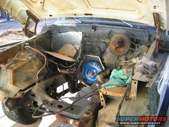 78-bronco-motor.jpg The empty engine compartment.  Removed the A/C box.  As soon as it gets warm will throw some paint in there.