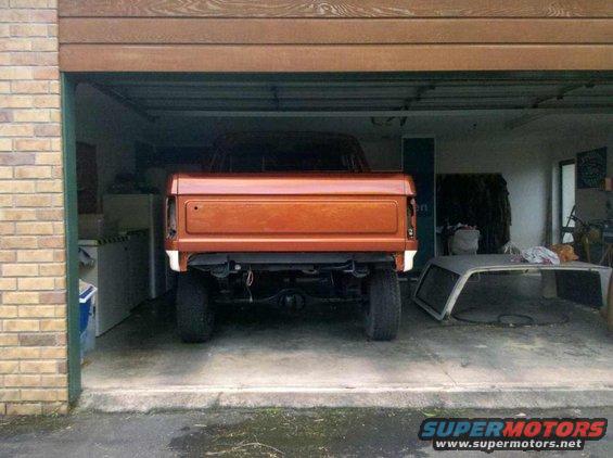 Orange 1982 Ford Bronco rear view in garage