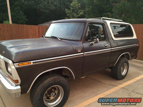 Dark brown 1978 Ford Bronco Ranger XLT with a white top, seen from the front 3/4 angle
