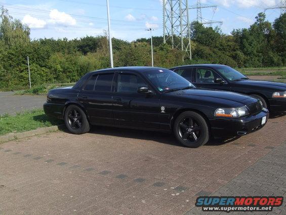 Two black 2003 Mercury Marauders parked side-by-side on pavement
