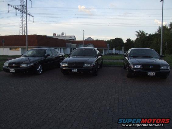 Three black 2003 Mercury Marauders parked in a lot