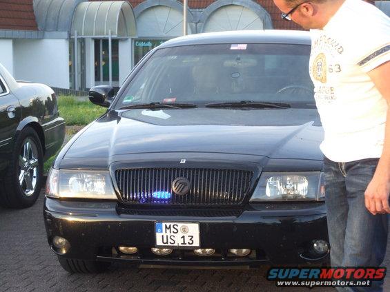 Black 2003 Mercury Marauder front view, grille with blue lights, license plate MS US 13
