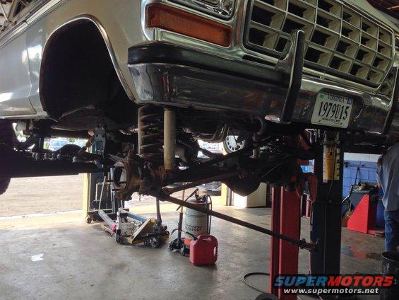 1979 Ford Bronco front suspension and undercarriage on lift, showing springs and steering components