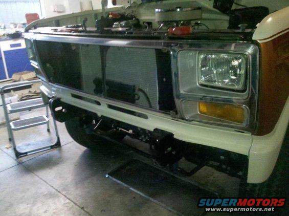 1982 Ford Bronco front end with hood open, showing grille and headlights