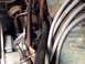 1973 Ford Bronco - A close-up view of various engine components, including spark plug wires and hoses, within an engine bay.