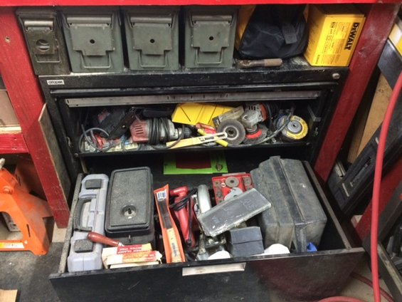 Toolbox with drawers full of tools and ammo cans on top