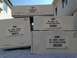 2004 Ford Crown Victoria - Several boxes of Ford Racing differential parts are stacked and displayed outdoors.