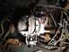 1973 Ford Bronco - Close-up view of engine components, including a carburetor and distributor cap.