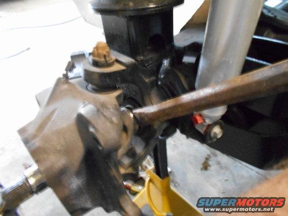 close-up of vehicle suspension components, possibly during repair