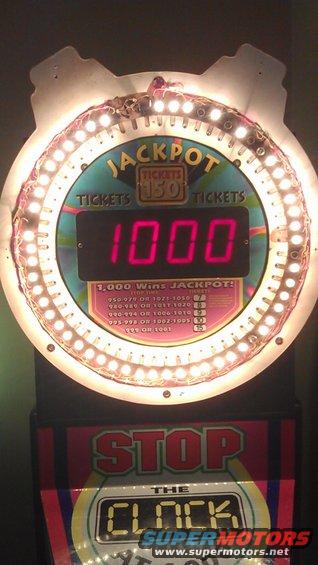 Jackpot display showing 1000 tickets, with 'Stop the Clock' below